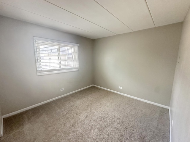 empty room with carpet flooring