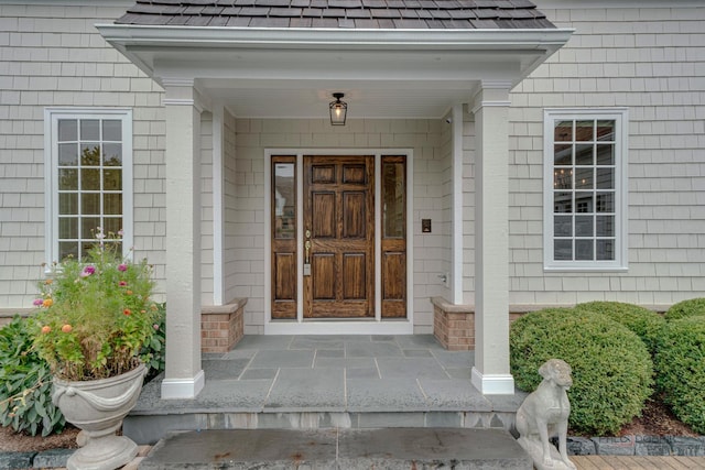 doorway to property featuring covered porch