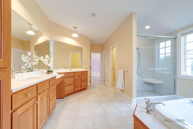 bathroom featuring tile patterned flooring, vanity, and independent shower and bath