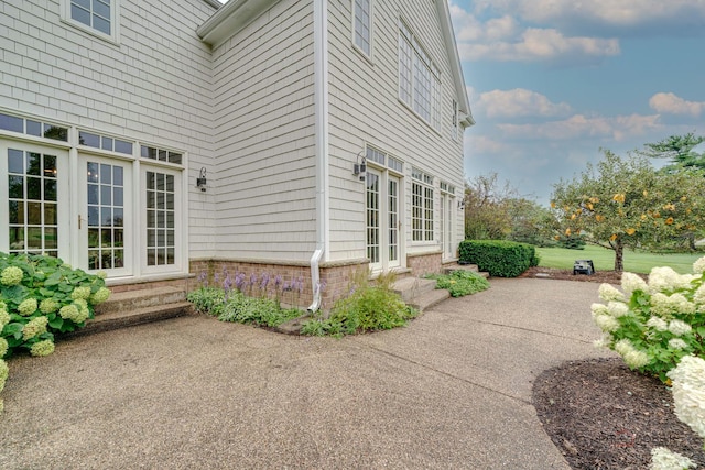 view of property exterior featuring a patio area