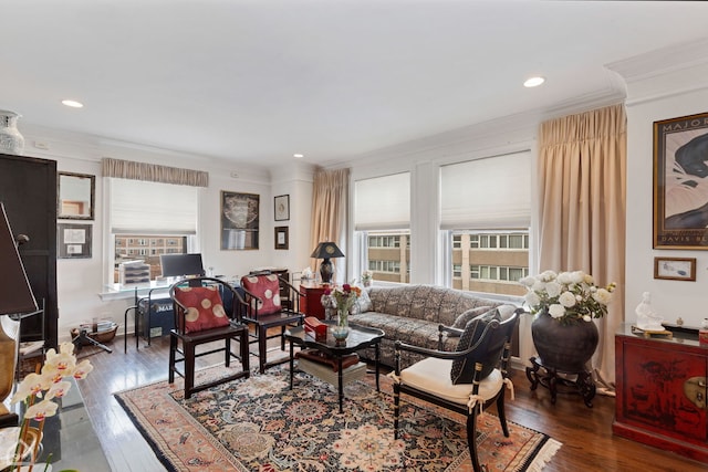 living room with dark hardwood / wood-style floors and ornamental molding