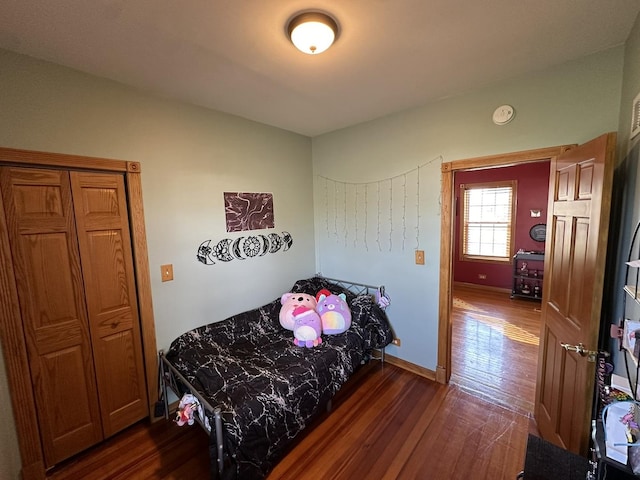 bedroom featuring dark hardwood / wood-style flooring