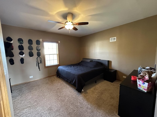 bedroom featuring light carpet and ceiling fan