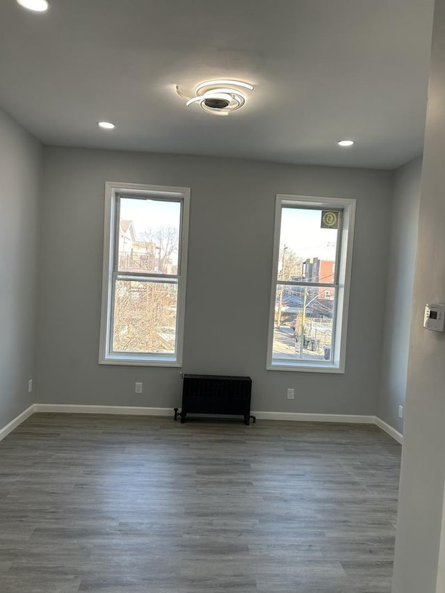 spare room featuring hardwood / wood-style floors