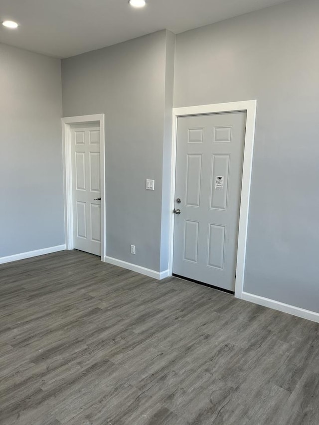 unfurnished room featuring dark hardwood / wood-style floors