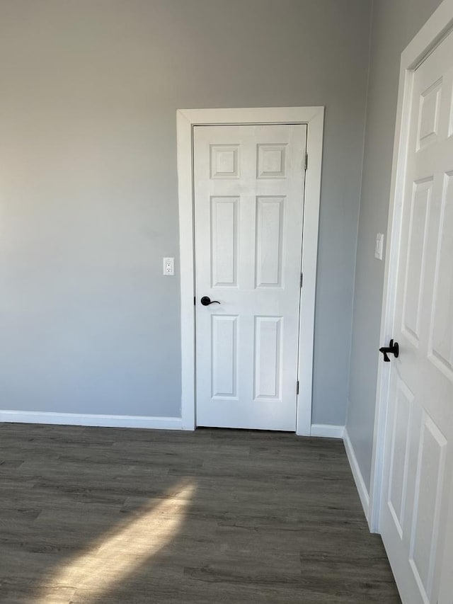 interior space with dark hardwood / wood-style floors