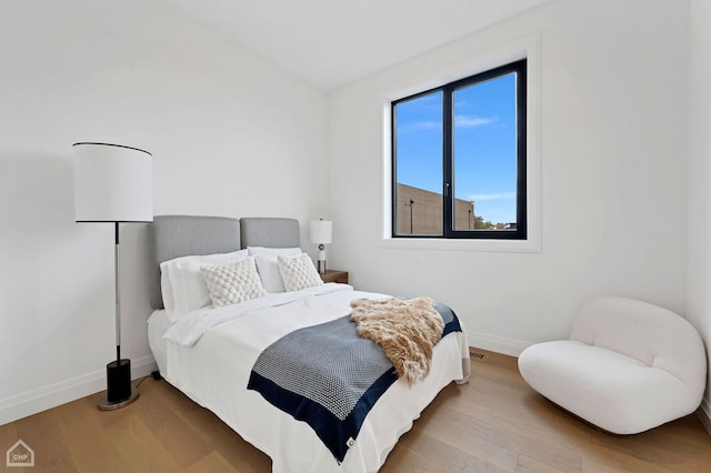 bedroom featuring hardwood / wood-style floors