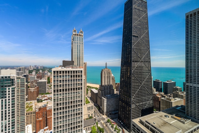 property's view of city featuring a water view