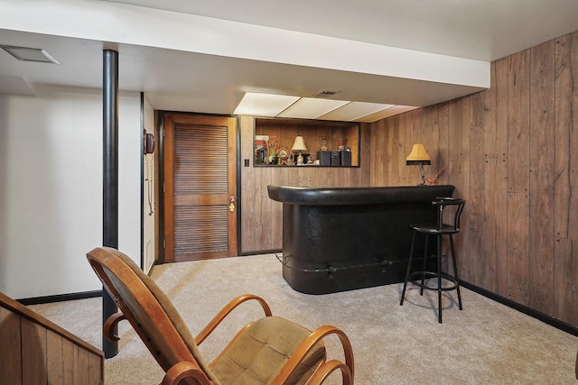 bar with light carpet and wooden walls