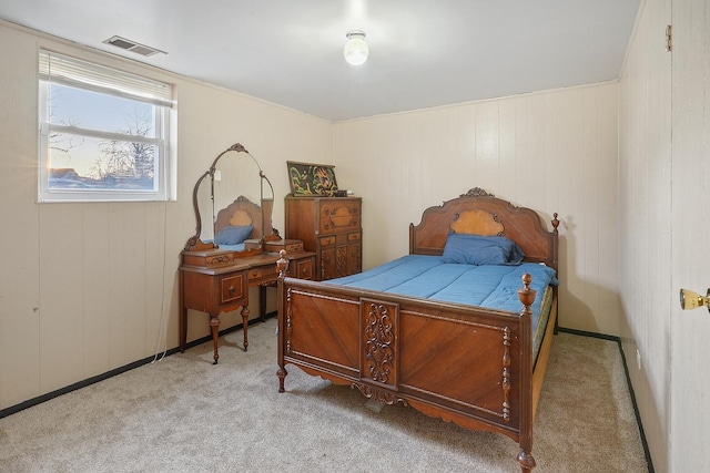 carpeted bedroom with wood walls