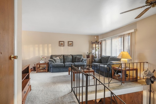 carpeted living room featuring ceiling fan