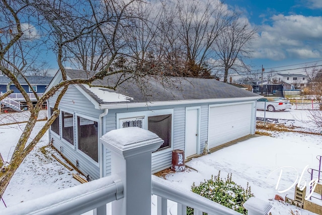 view of snow covered garage