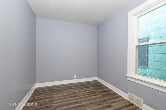 unfurnished room featuring dark hardwood / wood-style floors