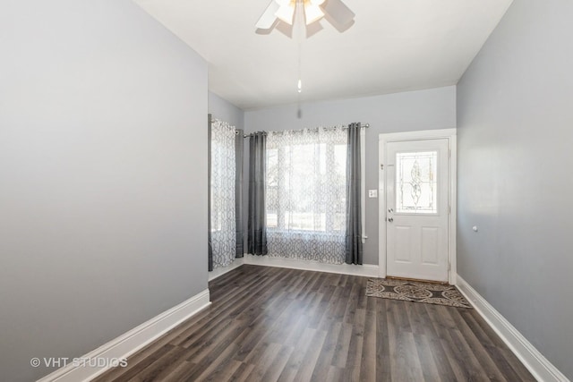 entrance foyer featuring ceiling fan and dark wood-type flooring