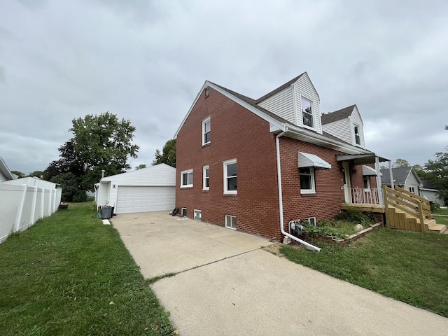 view of side of property featuring an outbuilding, a garage, and a lawn