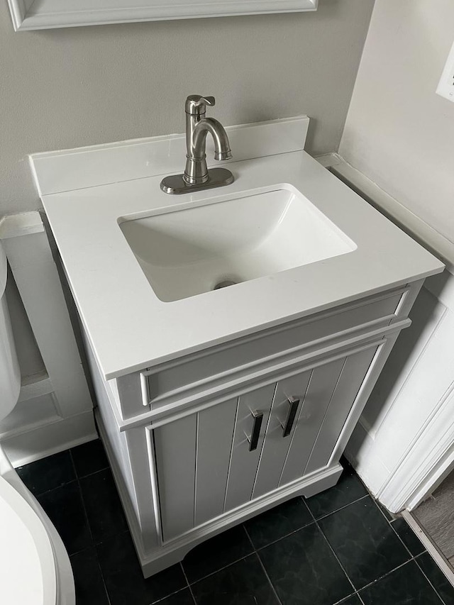 bathroom with vanity and tile patterned flooring