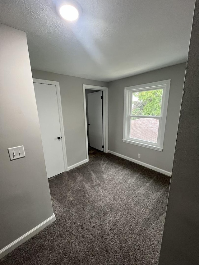 interior space with a textured ceiling