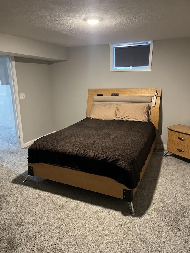 carpeted bedroom with a textured ceiling