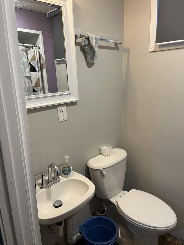 bathroom with sink and toilet