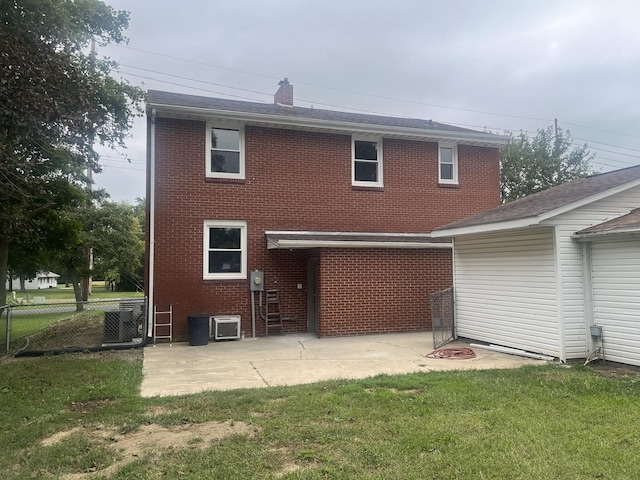 back of house with a patio, a yard, and cooling unit