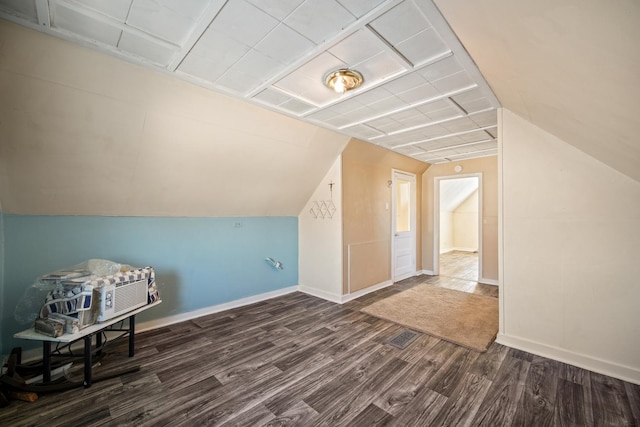 bonus room featuring dark wood-type flooring and lofted ceiling