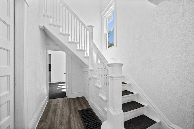 stairway with wood-type flooring