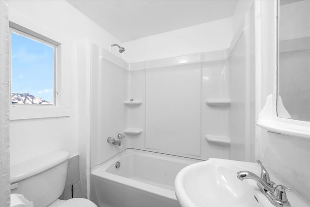 full bathroom with sink, tub / shower combination, and toilet