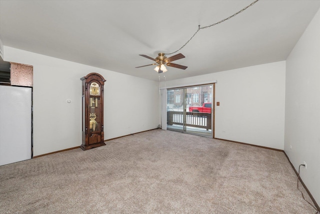 carpeted empty room with ceiling fan