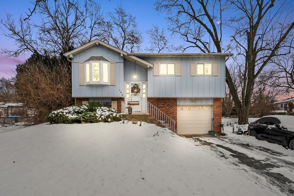 split foyer home featuring a garage