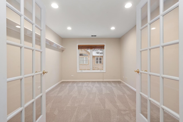 empty room with light colored carpet