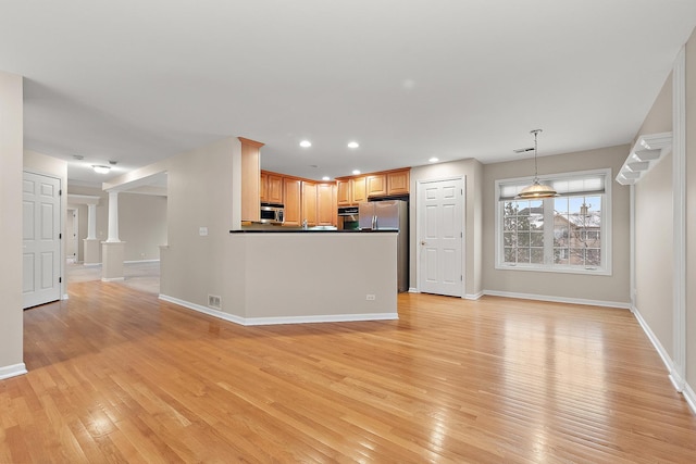 unfurnished living room with light hardwood / wood-style flooring