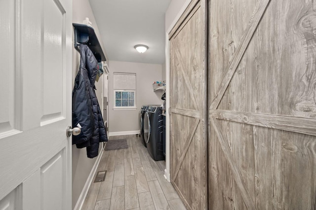 spacious closet featuring separate washer and dryer