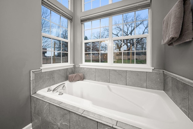 bathroom featuring tiled bath