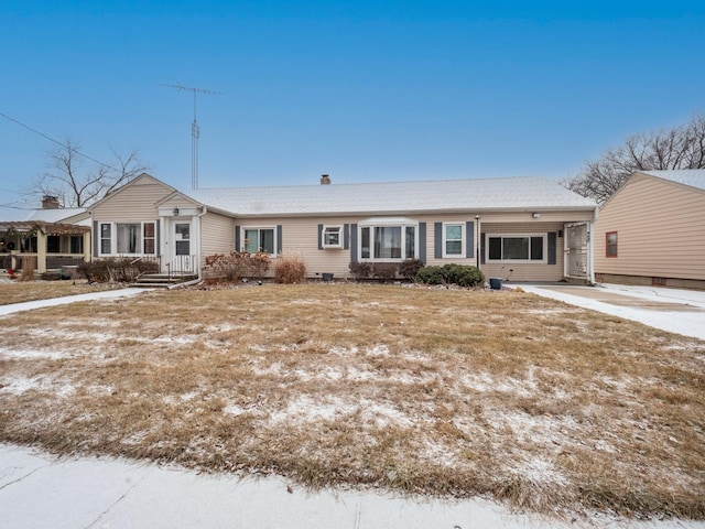 ranch-style house with a carport