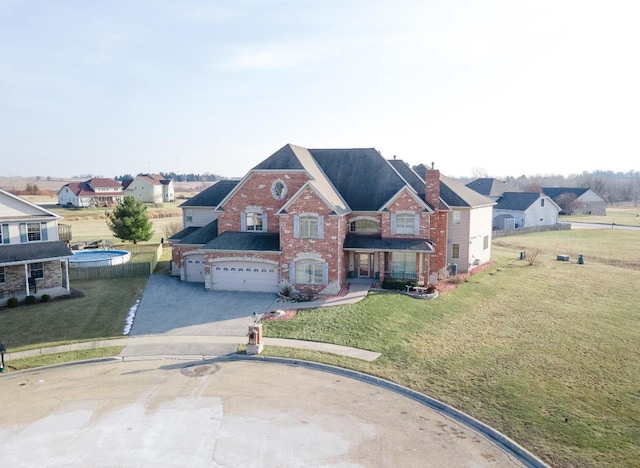 view of front of home with a garage and a front yard