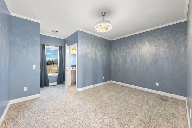 carpeted spare room with ornamental molding