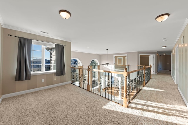 hall featuring light carpet and ornamental molding