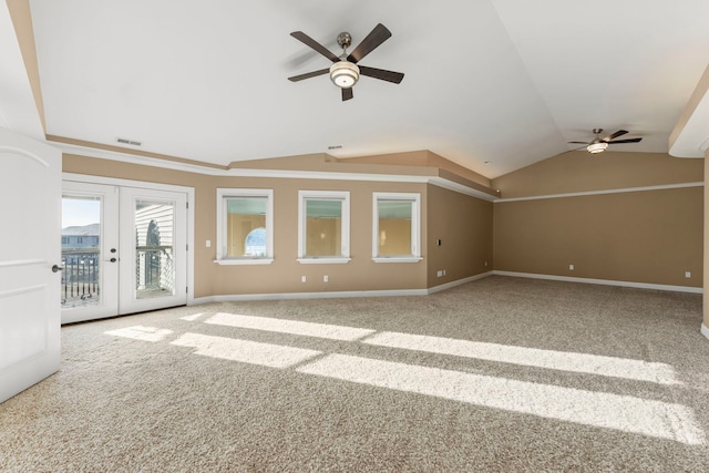 unfurnished living room featuring ceiling fan, carpet, lofted ceiling, and french doors