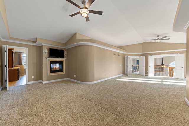 unfurnished living room with ceiling fan and carpet