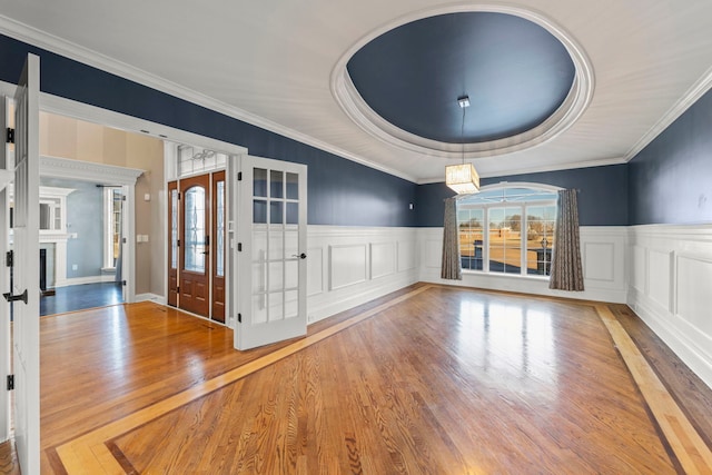 interior space featuring a healthy amount of sunlight, french doors, and ornamental molding