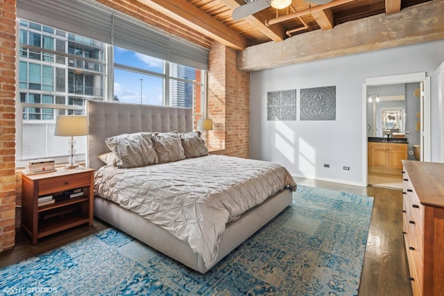 bedroom with dark hardwood / wood-style floors, ensuite bathroom, wood ceiling, ceiling fan, and beamed ceiling