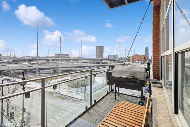 balcony featuring area for grilling