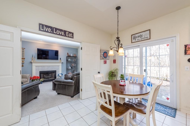 dining space featuring light carpet