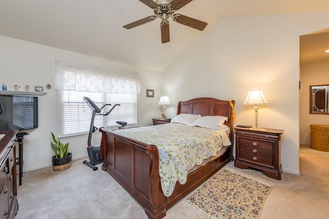 carpeted bedroom with vaulted ceiling and ceiling fan