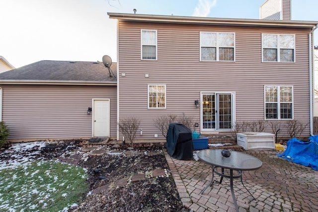 back of house with a patio area