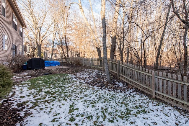 view of yard covered in snow