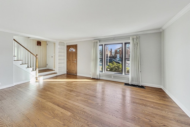 interior space featuring hardwood / wood-style floors and ornamental molding