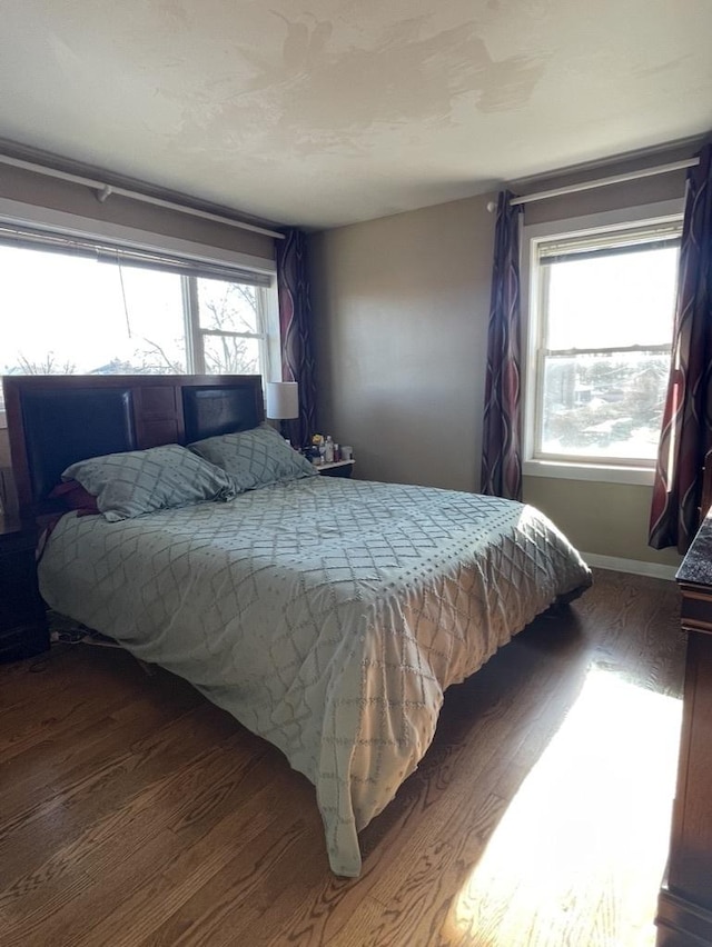 bedroom featuring dark wood-type flooring