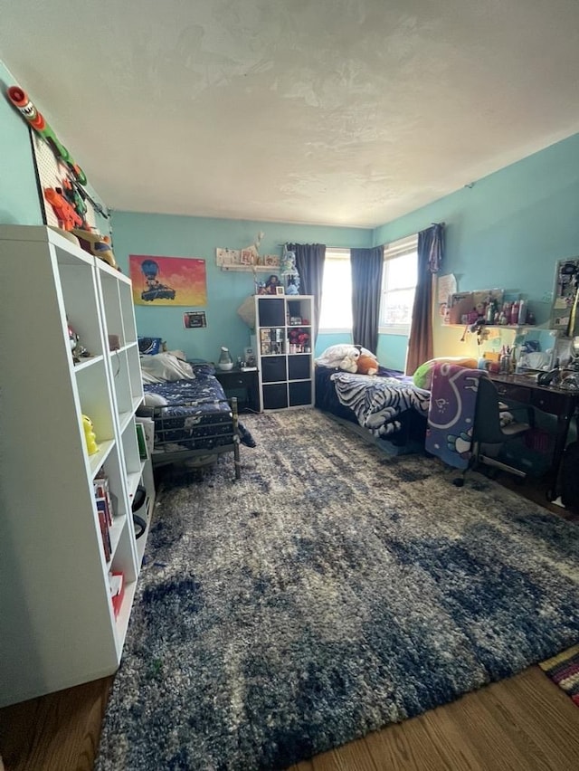 bedroom featuring hardwood / wood-style flooring