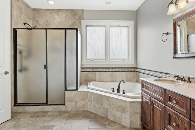 bathroom featuring vanity and plus walk in shower